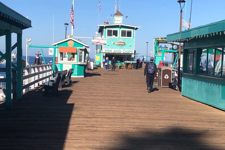 a group of people standing around a bus